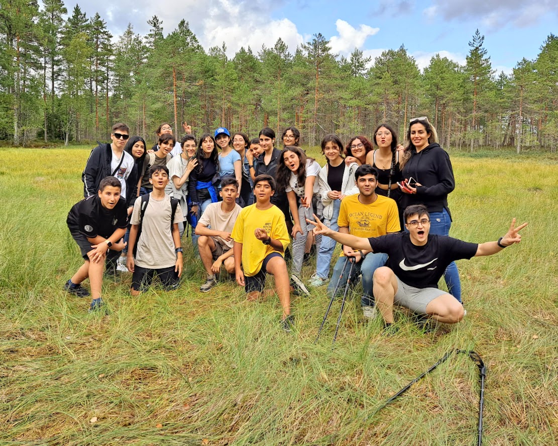 International campers on a guided swamp and forest exploration near the camp resort
